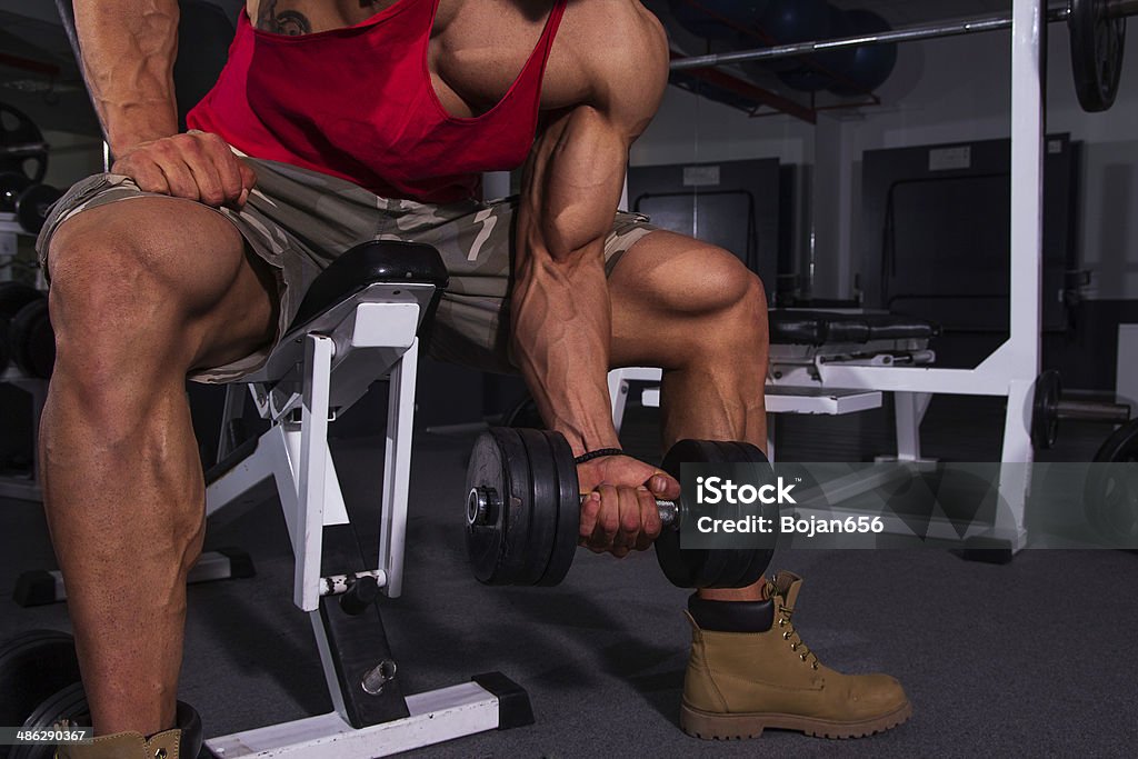 Biceps Exercise Biceps exercise in gym Adult Stock Photo