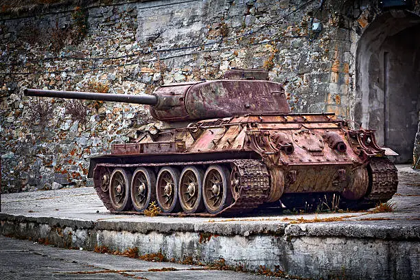 Rusty old tank T-34 in front of military fort in Kłodzko, Poland