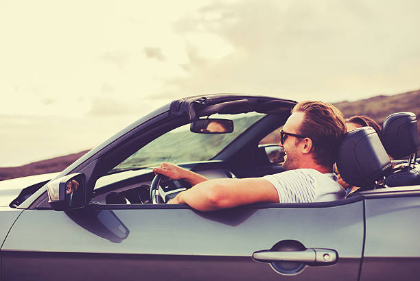 Happy Couple Driving in Convertible stock photo