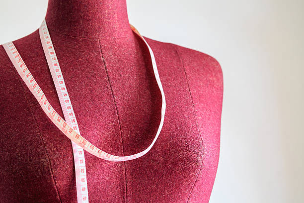 istock Clothing mannequin with measuring tape 486302054