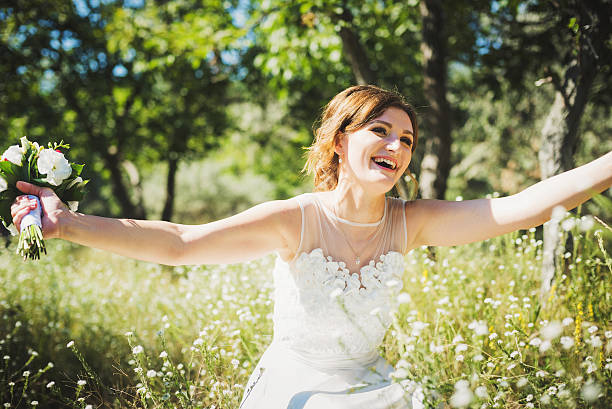 istock young caucasian bride in park 486304074
