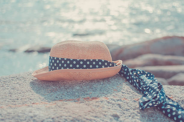 Sun hat on the rocks at the beach