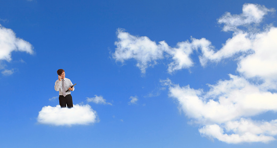 Man speaking mobile phone with cloud background, for cloud computing concept