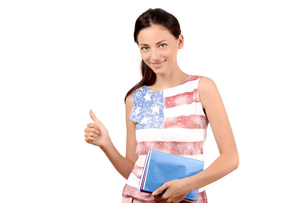 istock Student with USA flag on her blouse holding books. 486308420