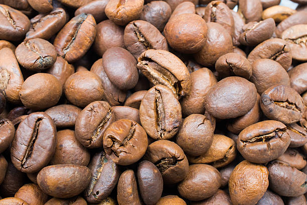 istock Black arabic coffee beans in close up photo 486308471