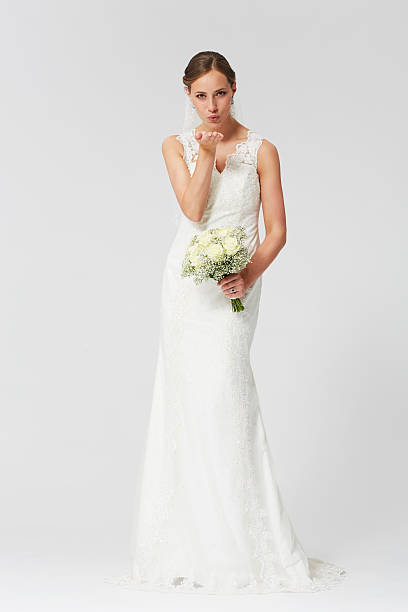 istock Happy bride with veil holding a bridal bougeut 486308971