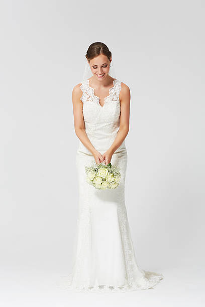 istock Happy bride ready to throw the bouquet 486309015