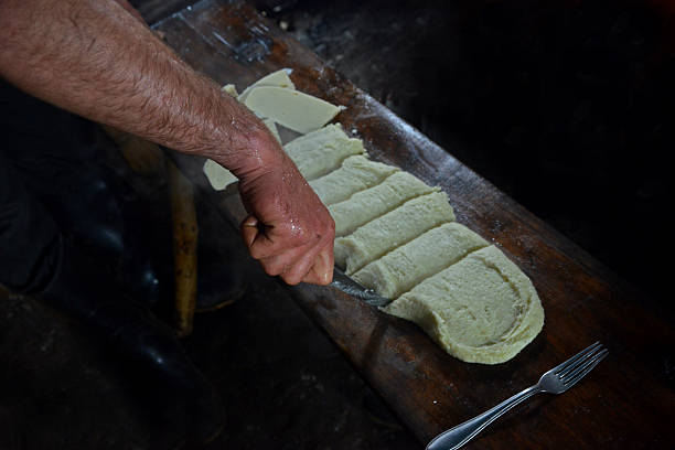 Mamaliga in Georgia Mamaliga is a tradition dish in Swaneti (Georgia). This porridge contains samp and suluguni cheese. People eat this meal as a pie. mamaliga stock pictures, royalty-free photos & images