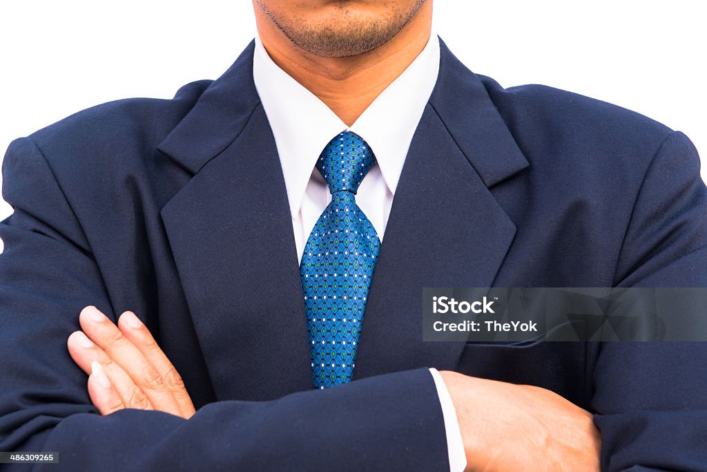 Businessman standing with closed posture, isolated Adult Stock Photo