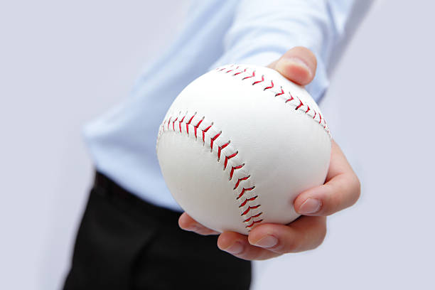 istock Business man hand holding a baseball 486310179