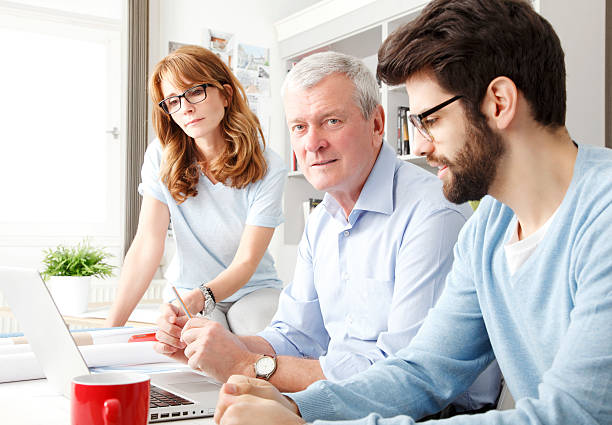 istock Business colleagues working on a laptop 486311035