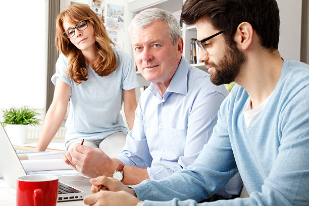 istock Business colleagues working on a laptop 486311039