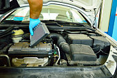 mechanic change the oil in a diesel car