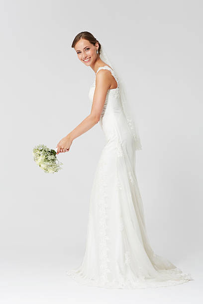 istock Happy bride ready to throw the bouquet 486311207