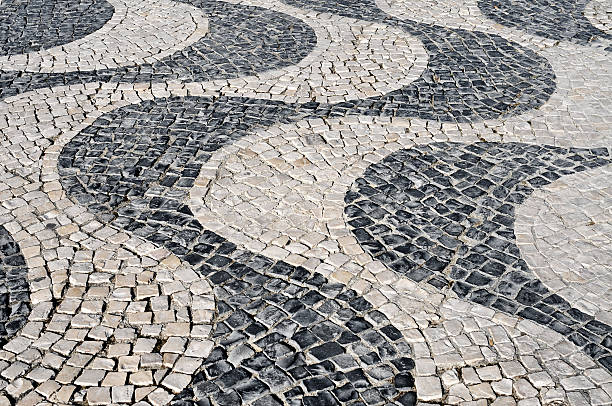 istock waves patterned portuguese pavement typical in Lisbon, Portugal 486311631