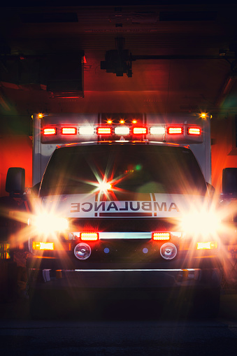 An ambulance with its lights flashing.