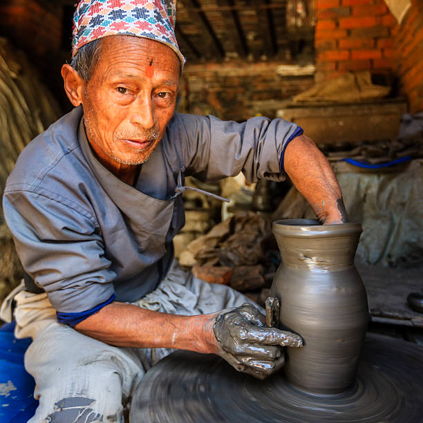istock Nepali potter working on the pottery square in Bhaktapur 486312389