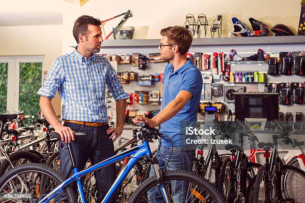 Man Buying Bicycle Stock Photo - Download Image Now - Bicycle, Buying, Bicycle Shop