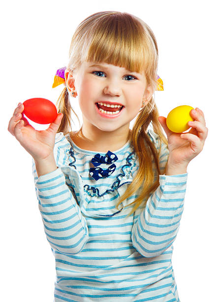 istock sweet little girl with yellow Easter egg 486314655