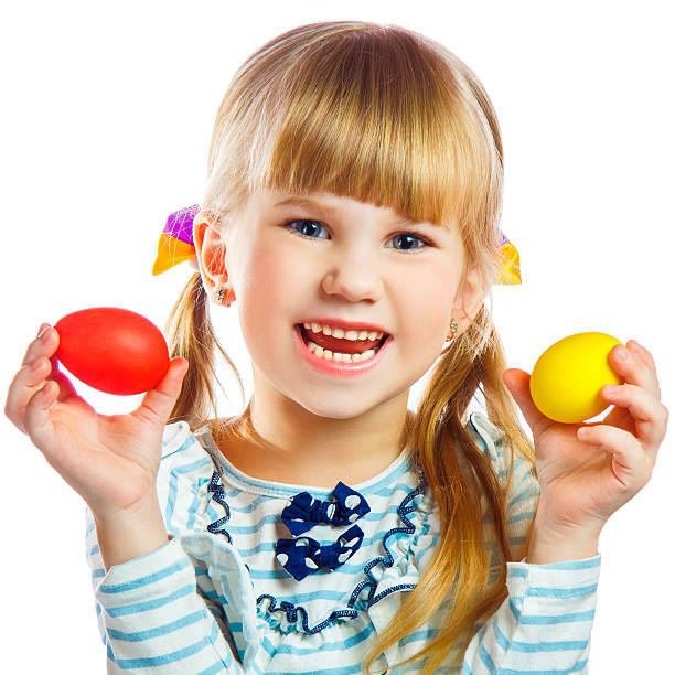 sweet little girl with yellow Easter egg stock photo