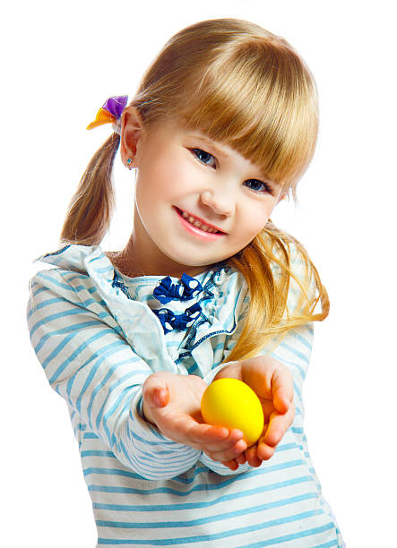 sweet little girl with yellow Easter egg stock photo