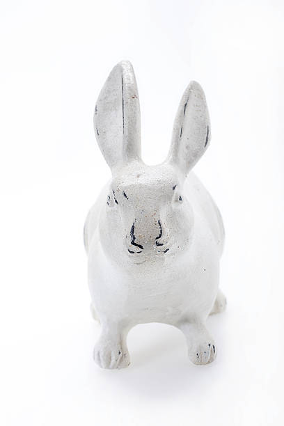 istock Seventy years old white rabbit made of gypsum front view 486315336