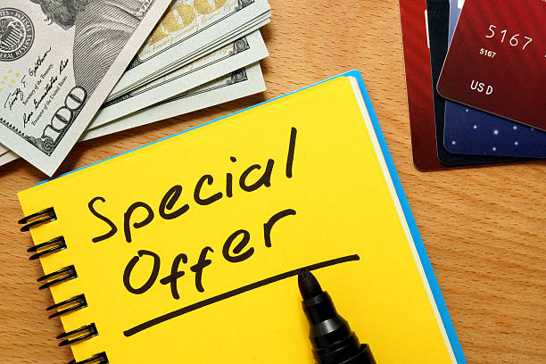 istock Notepad with special offer on a wooden table. 486319870