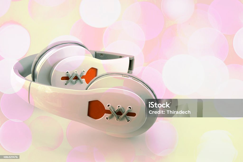 Bluetooth headset in bokeh Wireless headphones isolated on beautiful bokeh background 2015 Stock Photo