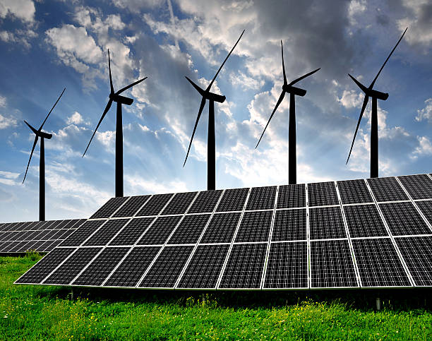 istock solar energy panels and wind turbines 486328925