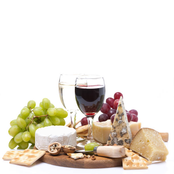 istock two glasses of wine, grapes, cheese and crackers, isolated 486328979