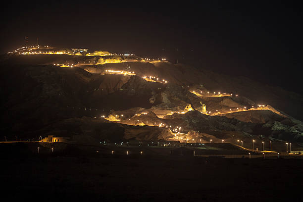 Night view of Jebel Hafeet and the lit road, UAE Night view of Jebel Hafeet and the lit road, Al Ain, UAE jebel hafeet stock pictures, royalty-free photos & images