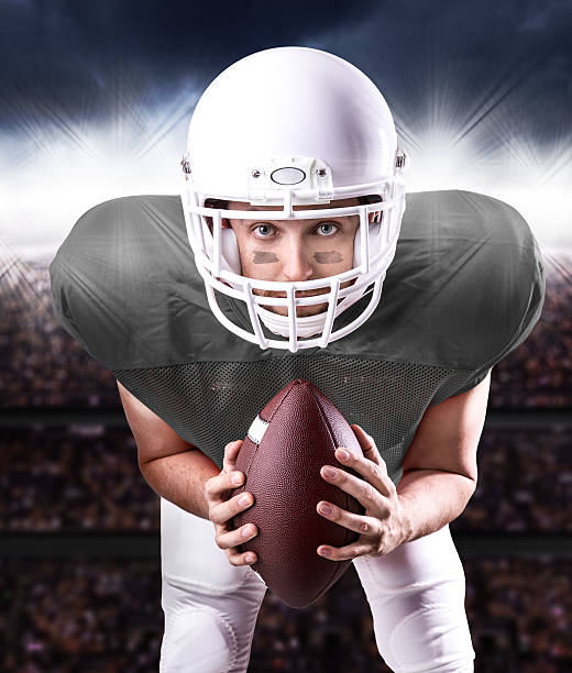 istock Football Player on gray uniform in the stadium 486332936