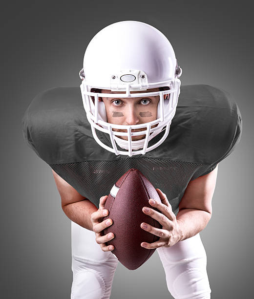 istock Football Player on gray uniform on gray background 486334448