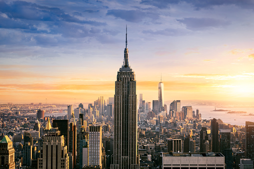 New York City skyline with urban skyscrapers at sunset, USA.