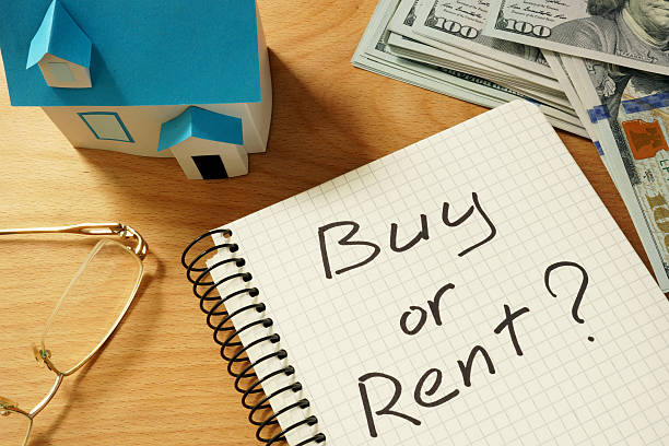 istock Notepad with buy or rent, home model and dollars. 486343030