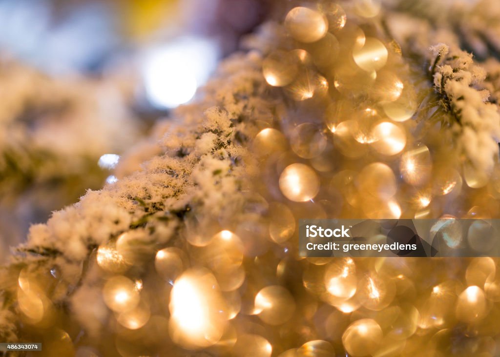 Christmas bokeh Close up, abstract colour image of a christmas decoration on a tree. 2015 Stock Photo