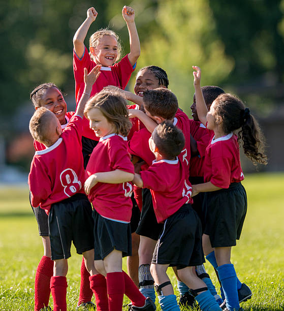 istock Girl is Raised Up by Teammates 486343628