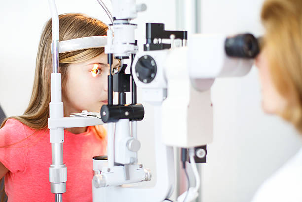 istock Little girl at optician. 486348628
