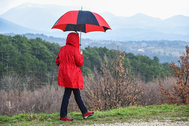 istock Woman walking outdoors in the rain 486350694
