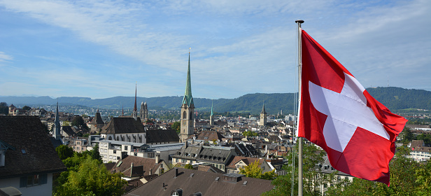 Grossmunster towers , with Swiss Flag on  the side