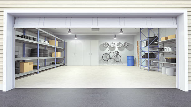 Open Garage Interior Modern empty garage interior viewing from outside of the open garage door. empty home garage stock pictures, royalty-free photos & images