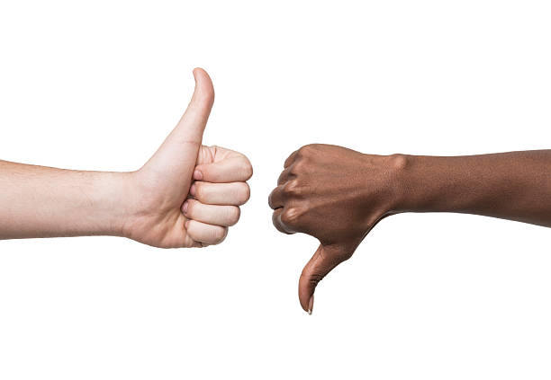 pollice su e giù le indicazioni con coppia di razza mista - thumbs up human thumb human hand conflict foto e immagini stock