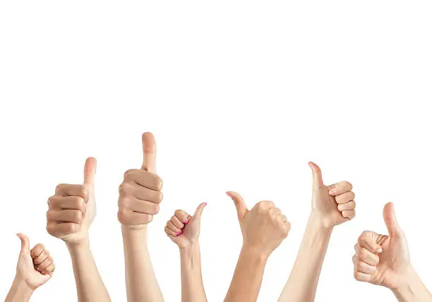Hands giving thumbs up against white background