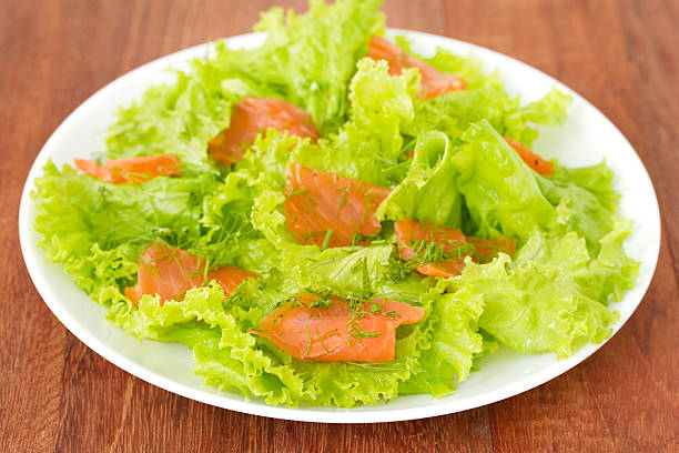 istock salad with salted salmon on plate 486352492