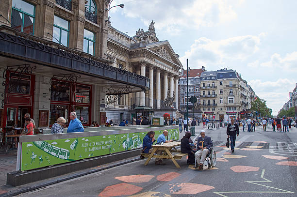 Brussels, Belgium - July 31, 2015: Brussels Stock exchange and animated street corner. The center of Brussels is now totally car free.