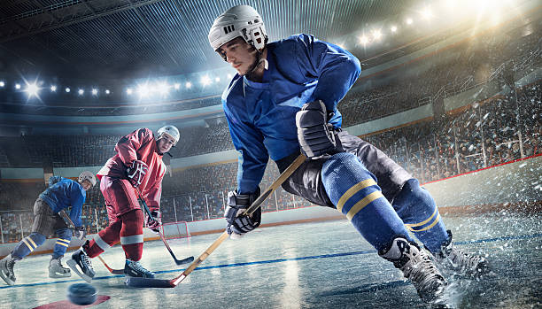 Ice Hockey Player on Hockey Arena Ice Hockey Player on Hockey Arena hockey stock pictures, royalty-free photos & images