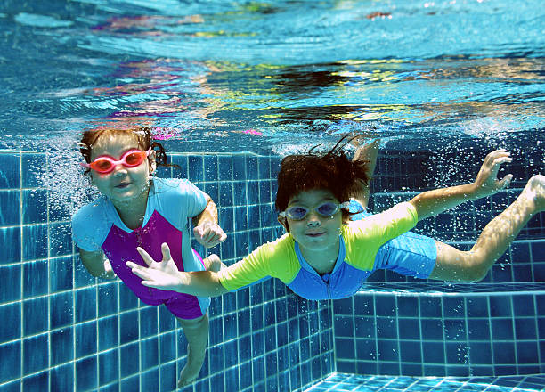 istock Children Swimming Underwater 486354403