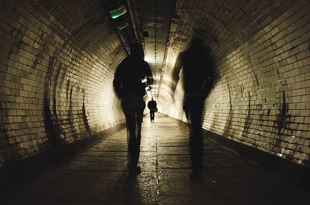 istock Two people walking in the tunnel 486355689