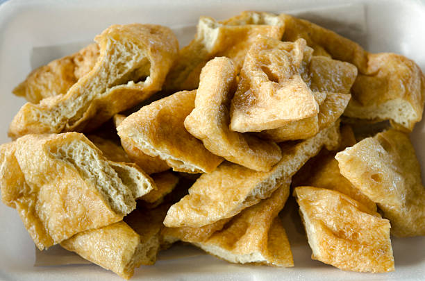 istock fried bean curd eaten with sauce 486357565