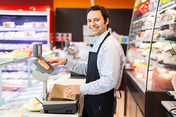 Smiling shopkeeper portrait